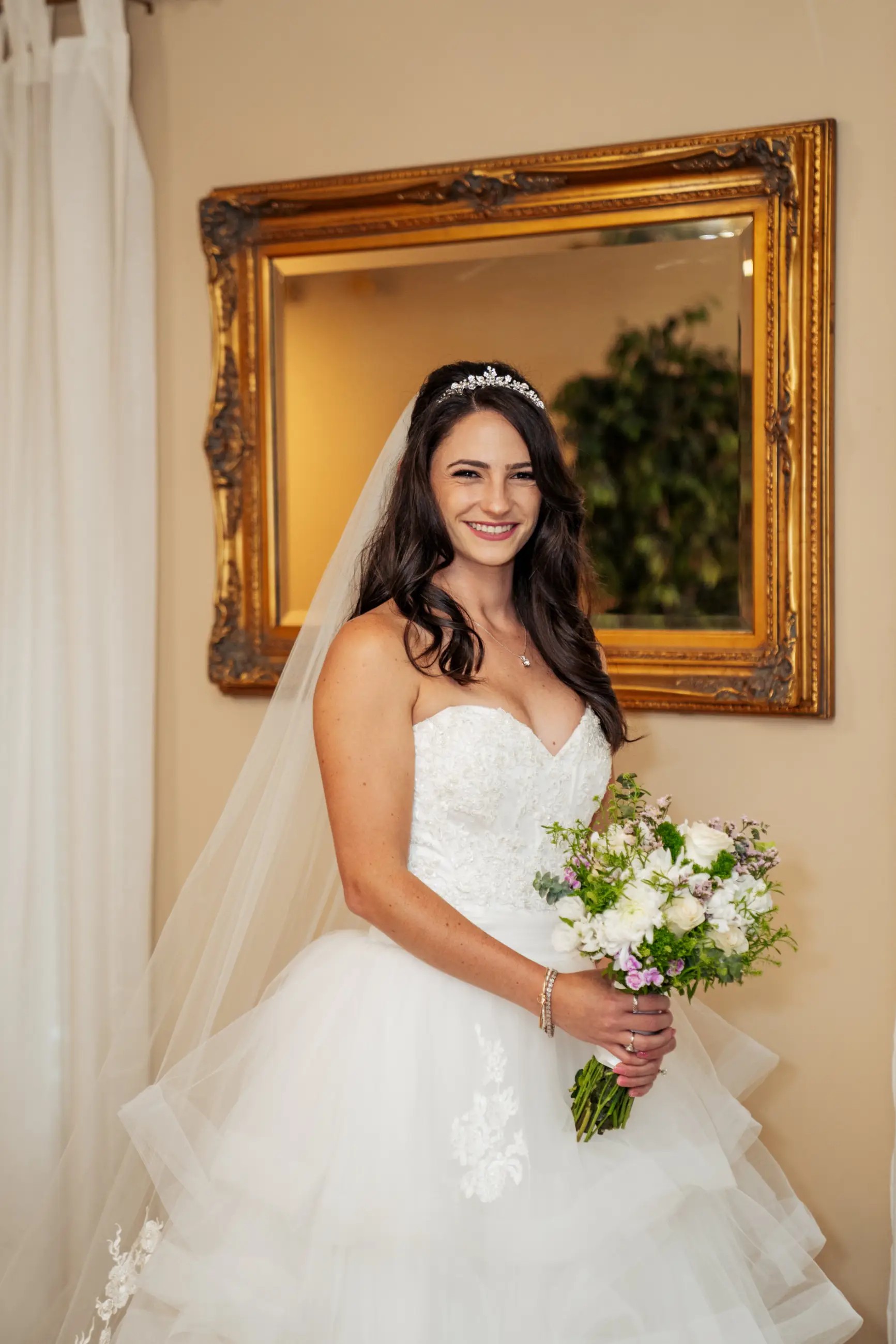 Model wearing a white gown