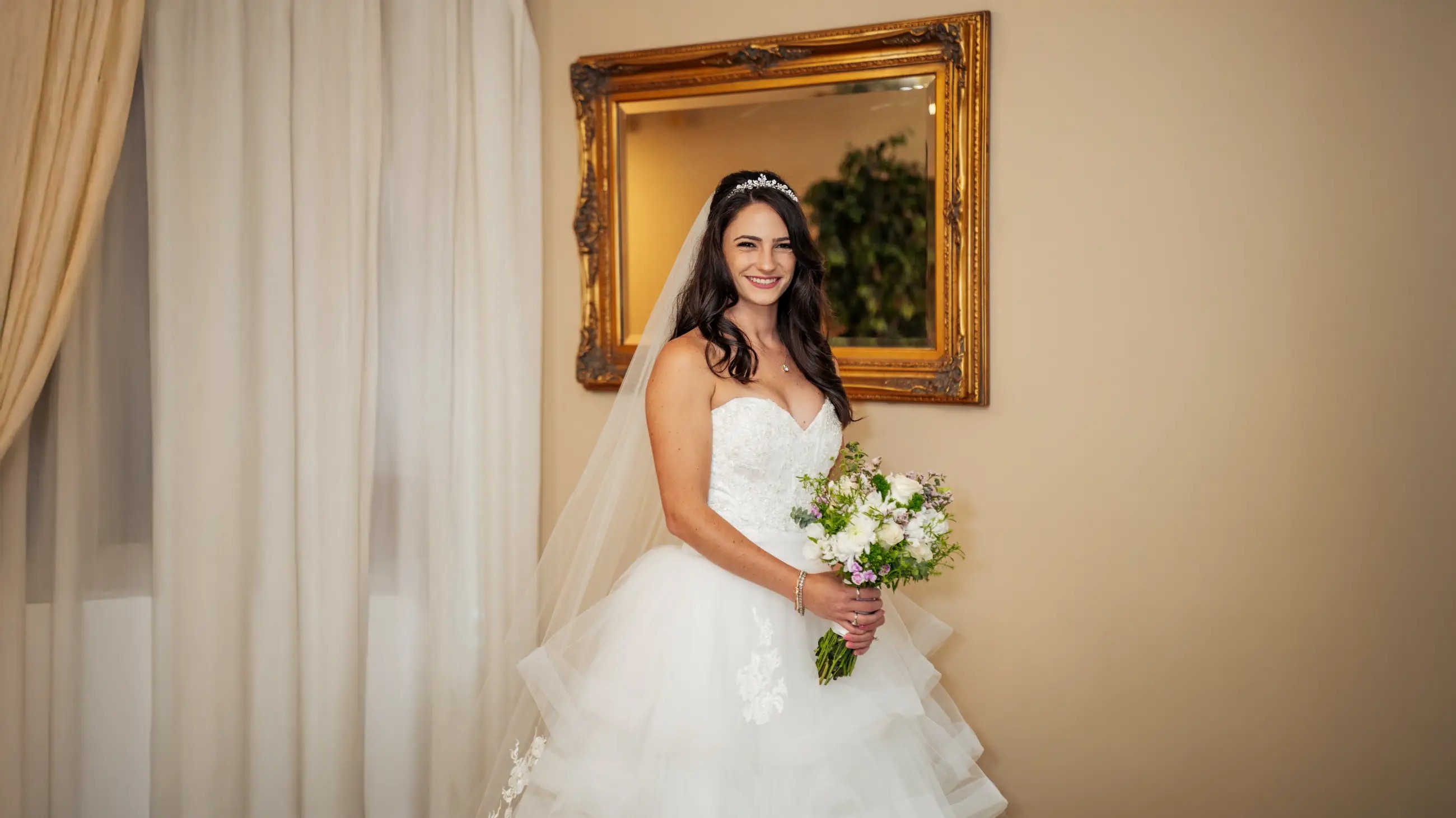 Model wearing a white gown