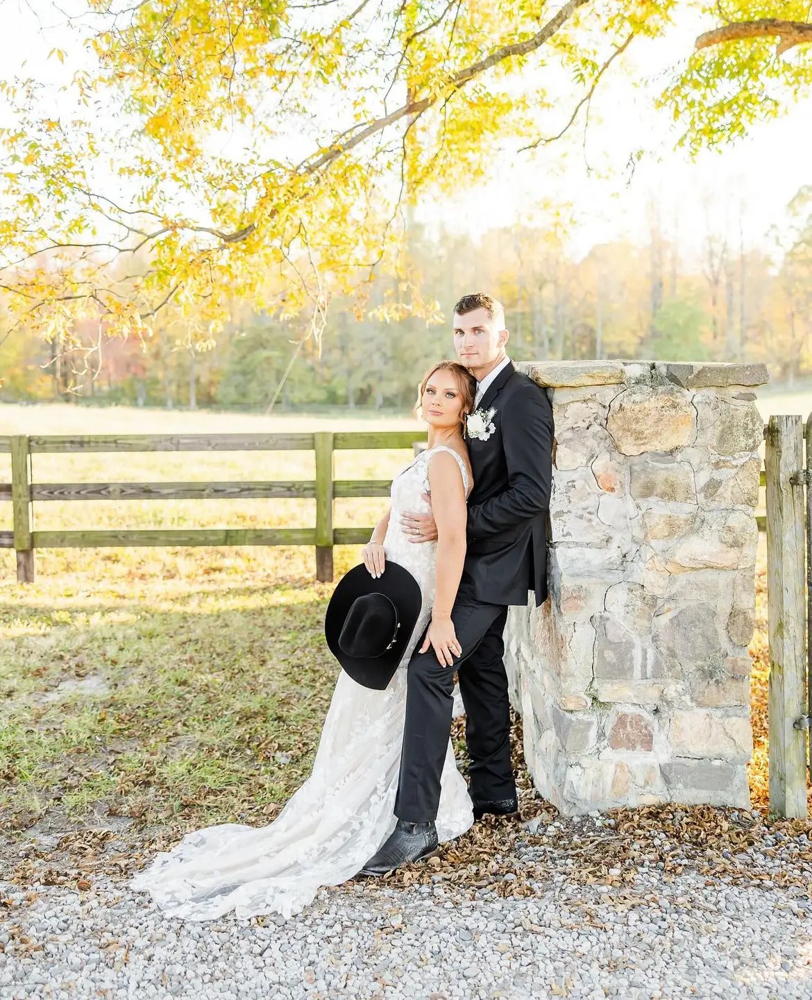 Сouple wearing a white gown and a black suit